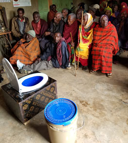 Introducing compost toilets to the village elders in Dongobesh, Tanzania, Africa.